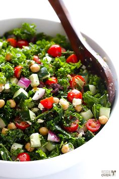 a white bowl filled with lots of salad