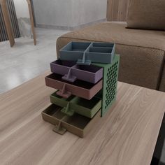 three drawers are stacked on top of each other at the end of a coffee table