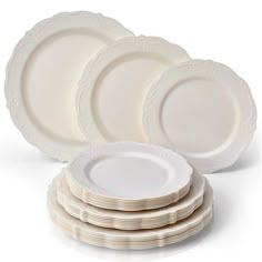 white dinner plates stacked on top of each other