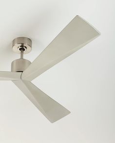 a white ceiling fan with two blades on it's sides and a light fixture in the middle