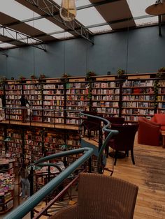 a library filled with lots of books and chairs