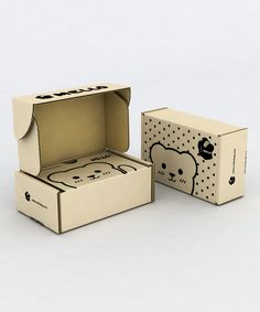 two boxes with the same design on each one, both open and closed to show an image of a teddy bear