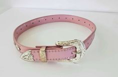 I'm selling a beautiful Nocona Girls Pink Leather and Rhinestone Belt Size 24 It measures 29" from top of leather at the buckle to the other silver tip end Worn once! Very Good Like New Condition! From non-smoke/pets home Pink Bb Simon Belt, Pink Corset Belt, Pink Rhinestone Belt, Bright Pink Belt, Nocona Belt, Pink Cowboy, Cowboy Belt, Rhinestone Belt, Pet Home