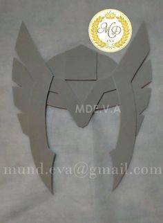 paper cut out of an angel's head with wings