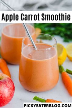 two glasses filled with carrot smoothie next to an apple