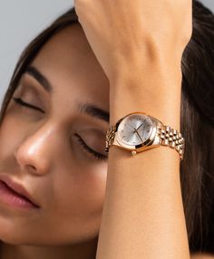 A classic design, elevated. The bold and urban Vivid watch features a statement round face with chunky outer casing that’s juxtaposed by the delicate sunray dial, minimalist numeral. In silver and white with a feminine rose gold twist and a 32mm face, Vivid is a powerful piece pairing androgynous design with robust links made of gold-plated stainless steel for effortless sophistication. Trendy Wrist Watches For Women, Everyday Watches Women Casual, Styling Watches Women, Timeless Jewelry Pieces, Feminine Watches, Classic Watches Women, Women Watches Classy Elegant, Classy Womens Watches, Trendy Watches Women