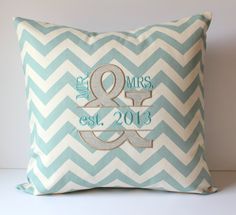 a blue and white chevron pillow with an amps and date on the front