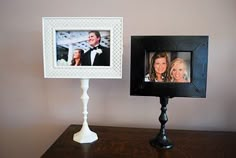 two pictures are placed on a table with a black and white lamp next to them