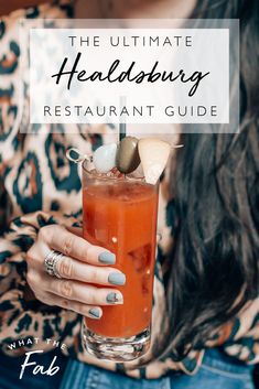 a woman holding a drink in her hand with the words, the ultimate healthy restaurant guide