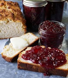 bread with jam and butter sitting on a table