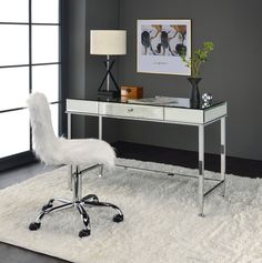 a white chair sitting in front of a desk with a lamp on top of it