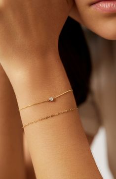 Dainty and delicate, this beautiful bracelet set was made to layer on your wrist. Waterproof and tarnish-free, this crafted in gold duo features a paperclip chain and classic linked chain with a lab-grown diamond. Made to last a lifetime Crafted in waterproof solid gold Set featuring two bracelets Length: 152mm - 6" + 31.7mm - 1.25"/ 152mm - 6" + 31.75mm - 1.25" Weight: 0.60g, 0.55g Chain Width: 1.3mm - 0.05", 0.8mm - 0.03" Carat: 0.06tcw Clarity: GHSI Stone Diameter: 2.5mm - 0.1" Spring Ring Cl Wedding Jewelry Bracelet, Dainty Bracelets Gold Delicate Jewelry, Forever Bracelets Gold, Women’s Bracelets, Bracelet Inspo Gold, Gold Breclates Girl, Homecoming Jewelry Gold, Gold Bracelet Dainty, Dainty Everyday Jewelry