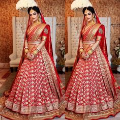 a woman in a red and gold bridal gown