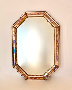 a mirror that is hanging on the wall