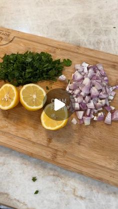 chopped onions, lemons and parsley on a cutting board