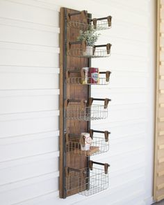 a wall mounted shelf with baskets on it