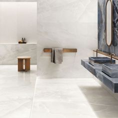 a modern bathroom with marble walls and flooring