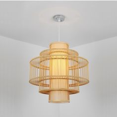 a chandelier hanging from the ceiling in a room with white walls and flooring