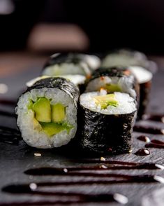 sushi rolls with cucumber and sesame seeds