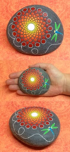 hand painted rocks with dragonflys on them and the light coming from one rock