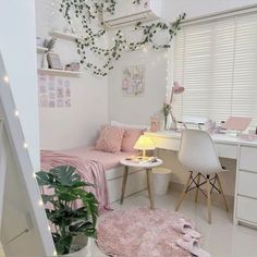 a bedroom with white walls and pink decor