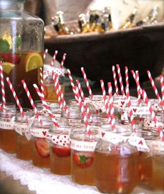 a web page with several jars filled with liquid and strawberries on top of each jar