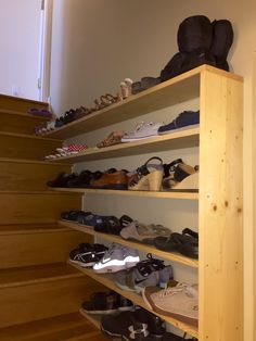 there are many pairs of shoes on the shelves