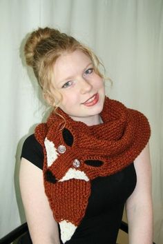 a woman wearing a knit fox scarf