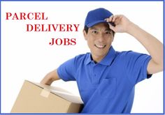 a man in a blue shirt is holding a cardboard box