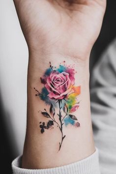 Colorful watercolor rose tattoo on forearm. Watercolor Rose Tattoo, Small Wrist Tattoos For Women, Small Wrist Tattoo Ideas, Watercolor Tattoo Design, Watercolor Flower Tattoo, Resilience Tattoo, Small Wrist Tattoo, Watercolour Tattoos, Minimalist Butterfly