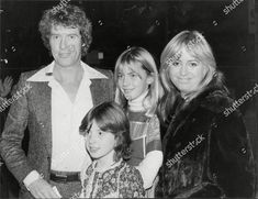 an old black and white photo of three people posing for the camera with one woman