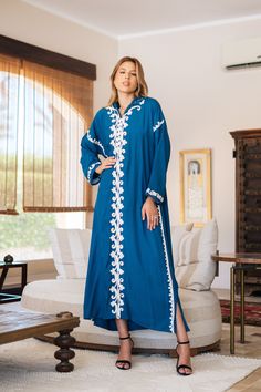 *Note : The kaftan in the video is a different color and is only displayed to show the fit, flow, and cut of the Kaftan. You will receive the one in the pictures.* Feel like a Royalty! This Kaftan maxi dress is ideal to wear for any casual occasion. Whether a wedding, gathering, taking a trip down the shopping lane, or home-based kitty parties, or about anything else, wearing this dress will make you feel classy and comfortable.  The perfect house dress for lounging or having a coffee in your ba Embroidered Abaya For Eid Vacation, Bohemian Blue Floor-length Kurta, Tunic Abaya For Eid Vacation, Blue Long Kaftan With Dabka Detailing, Eid Vacation Tunic Abaya, Embroidered Maxi Length Blue Abaya, Eid Tunic Abaya For Vacation, Eid Beach Kimono, Long Blue Dabka Kaftan