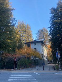 an apartment building with trees in the background