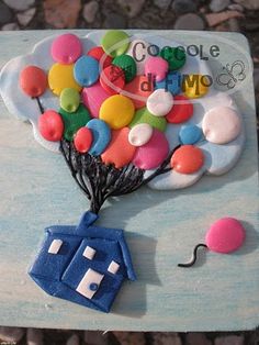 a cake made to look like a balloon with the word google on it and a house