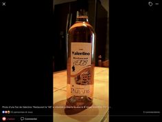 a bottle of wine sitting on top of a counter