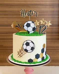 a soccer themed birthday cake on a table