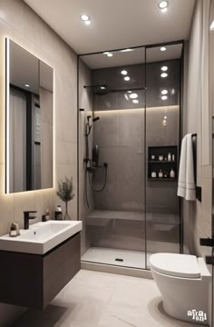 a bathroom with a toilet, sink and shower stall in the middle is lit by recessed lights