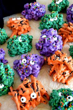 there are many halloween treats made to look like monsters on the table with sprinkles