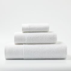 three white towels stacked on top of each other