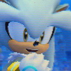 sonic the hedgehog is smiling in front of a blue sky with clouds and yellow circles