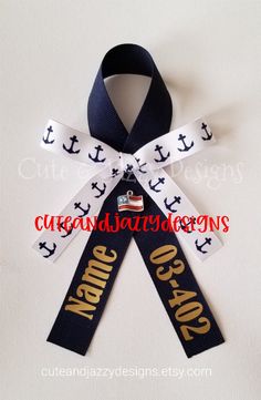 a ribbon with an anchor and name on it