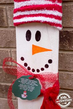 a close up of a snowman on a pole