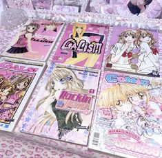 there are many anime covers on the table