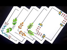 four cards with designs on them sitting next to each other