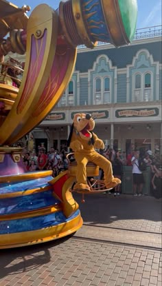 the mickey mouse rides in front of a crowd at disney's california adventure park