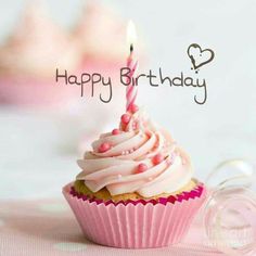 a pink cupcake with a single candle on it's top and the words happy birthday