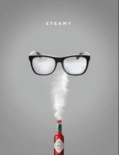 a bottle that has steam coming out of it and glasses on top of the bottle