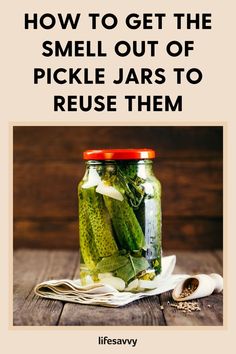 pickles in a jar with the title how to get the smell out of pickle jars to reuse them