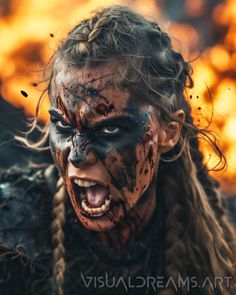 a woman with makeup on her face and hair covered in black paint, is screaming