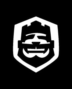 a man with a beard and goggles in the middle of a shield on a black background